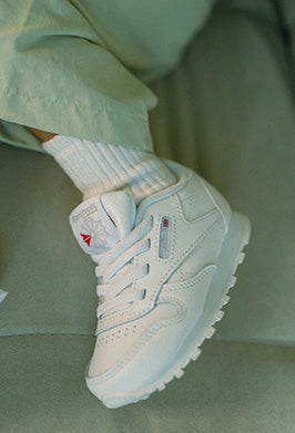 Close-up of a mint green kids sneaker