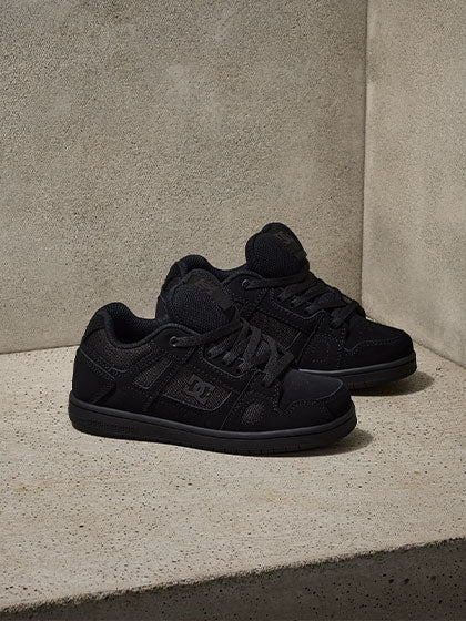 Black sneakers on a concrete background