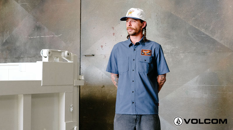 Person in workwear standing inside workshop